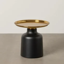 Casa Viva Mesa auxiliar de metal negra y dorada Ø50x47,50cm Outlet